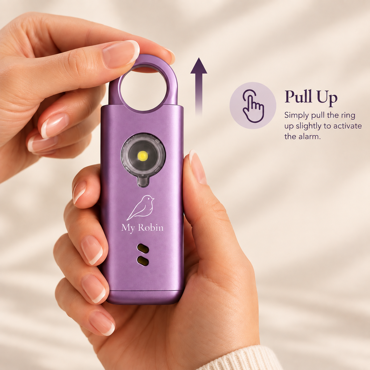 Purple My Robin personal safety alarm showing how to pull up the ring to activate the alarm